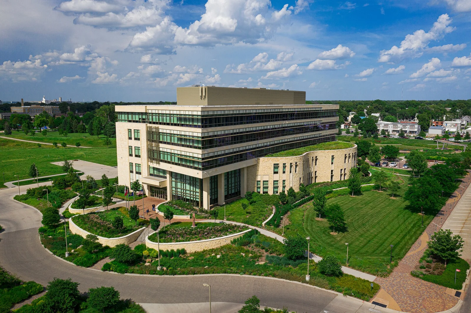 Exterior of the Assurity Center in Lincoln, Nebraska, surrounded by landscaped grounds.